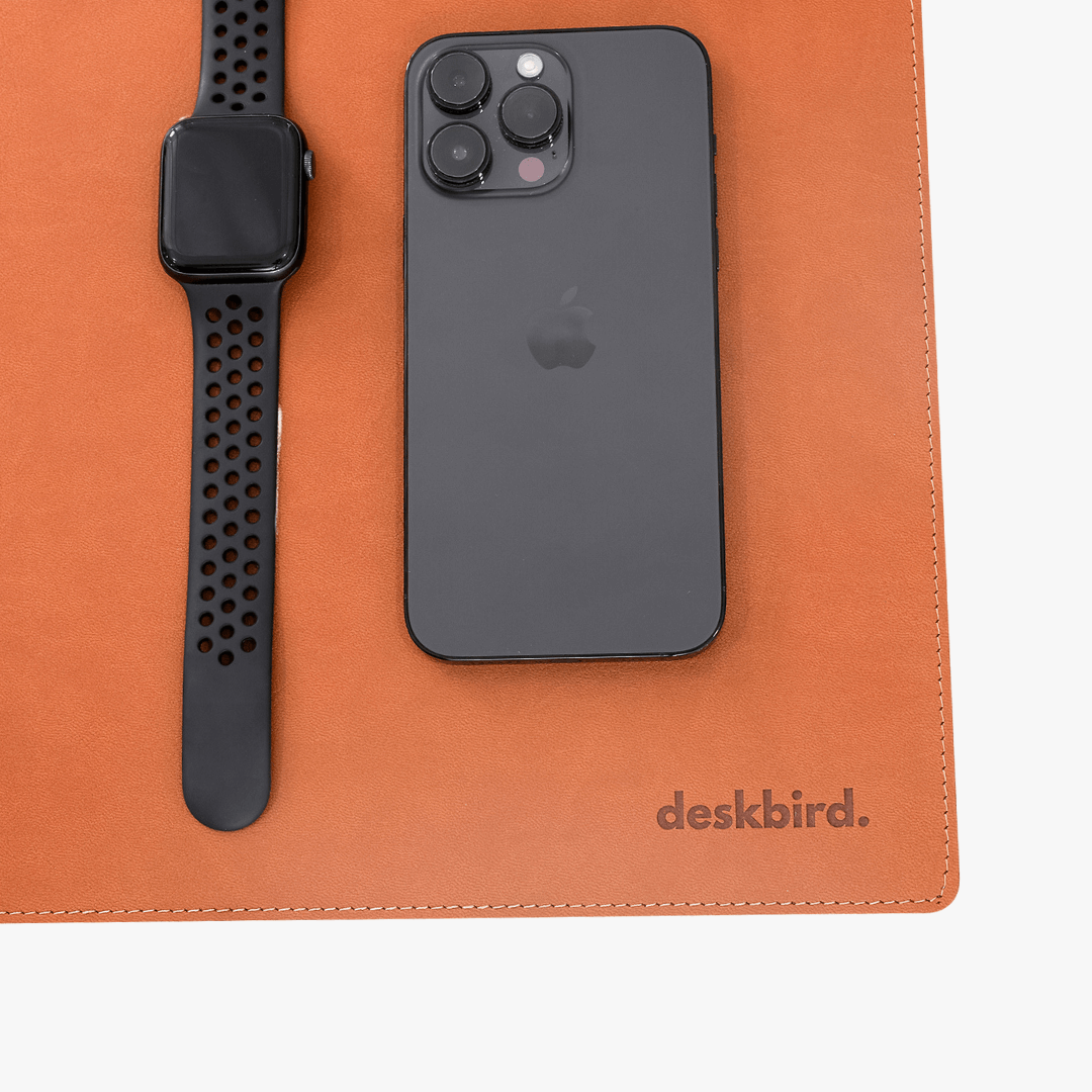 phone and watch on deskpad