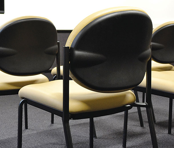 yellow essence chair with black frame